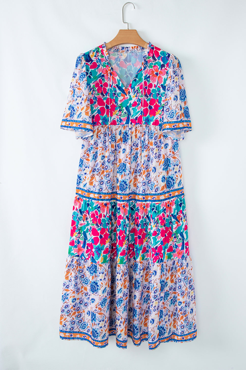 Brenna™ | Vestido azul cielo con estampado floral mixto, mangas cortas y cuello con abertura para atar