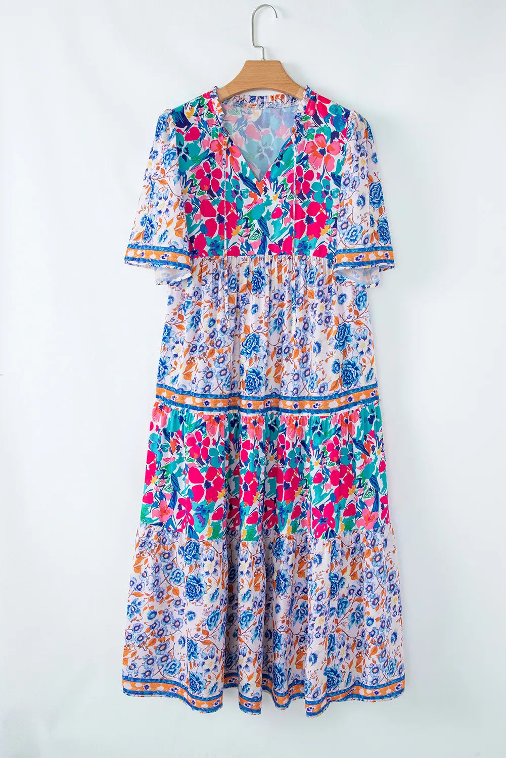 Brenna™ | Vestido azul cielo con estampado floral mixto, mangas cortas y cuello con abertura para atar